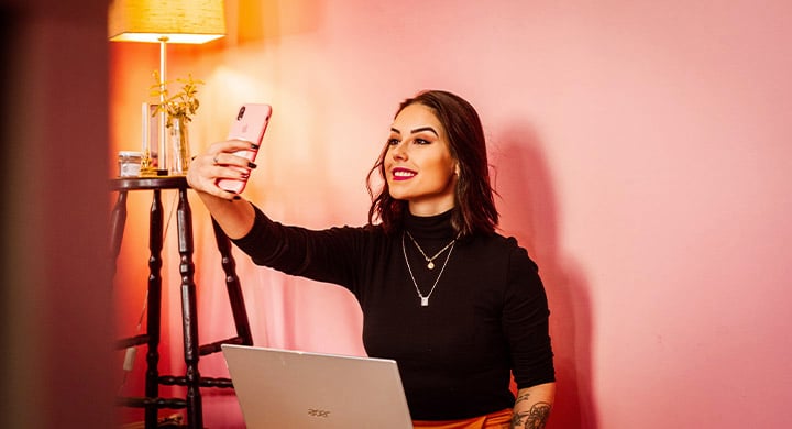 Woman Taking a Selfie - Toggle Insurance