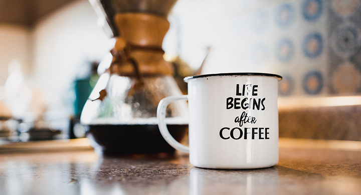 Coffee and a Coffee Cup that Says, “Life Begins After Coffee” - Toggle Insurance 