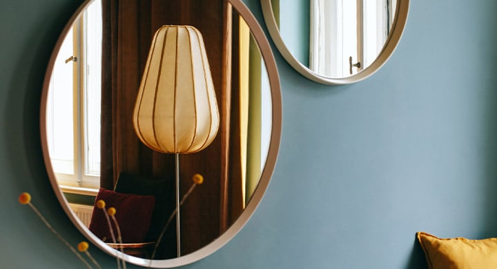 Green Wall with Decorative Mirrors - Toggle Renters Insurance