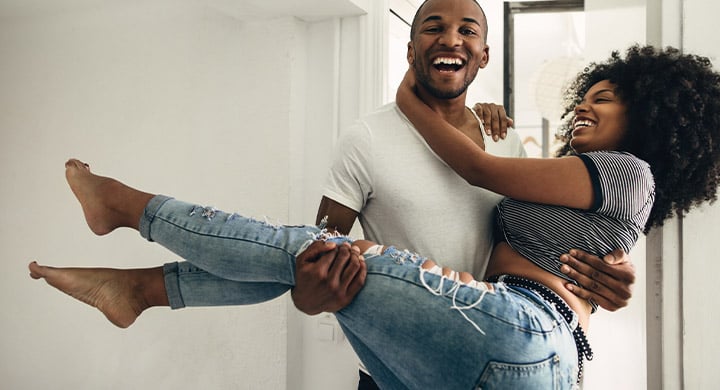 Man Holding a Woman in His Arms - Toggle Renters Insurance