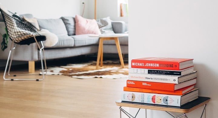 Stack of Books in Living Room - Toggle Renters Insurance