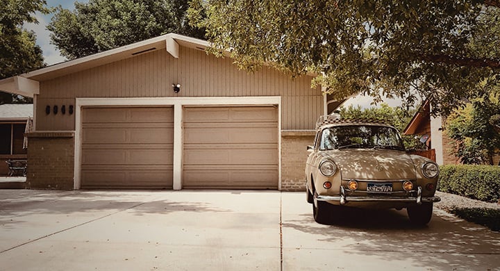 1969 VW near tree in front of garage