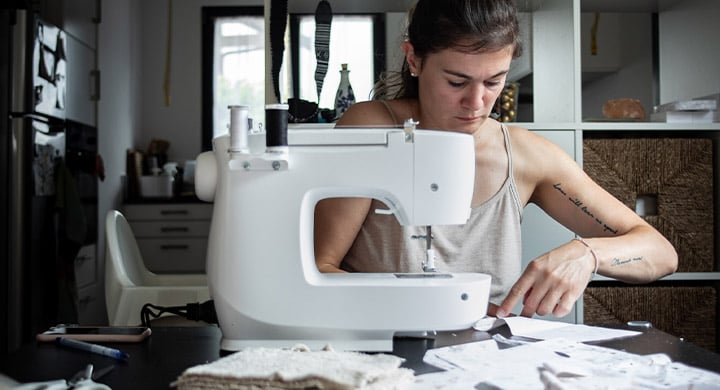 Woman Sewing - Toggle Insurance Creative + Maker Coverage