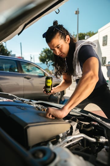 Man Checking Car Engine Oil - Toggle Auto Insurance